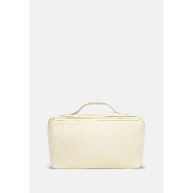 Rozkładana, skórzana kosmetyczka w beżowym kolorze z uchwytem, z tłoczonym logo marki Cholewiński na przodzie produktu, zdjęcie z przodu